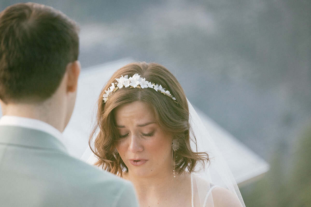 Bride tearfully shares her wedding vows on her elopement day.