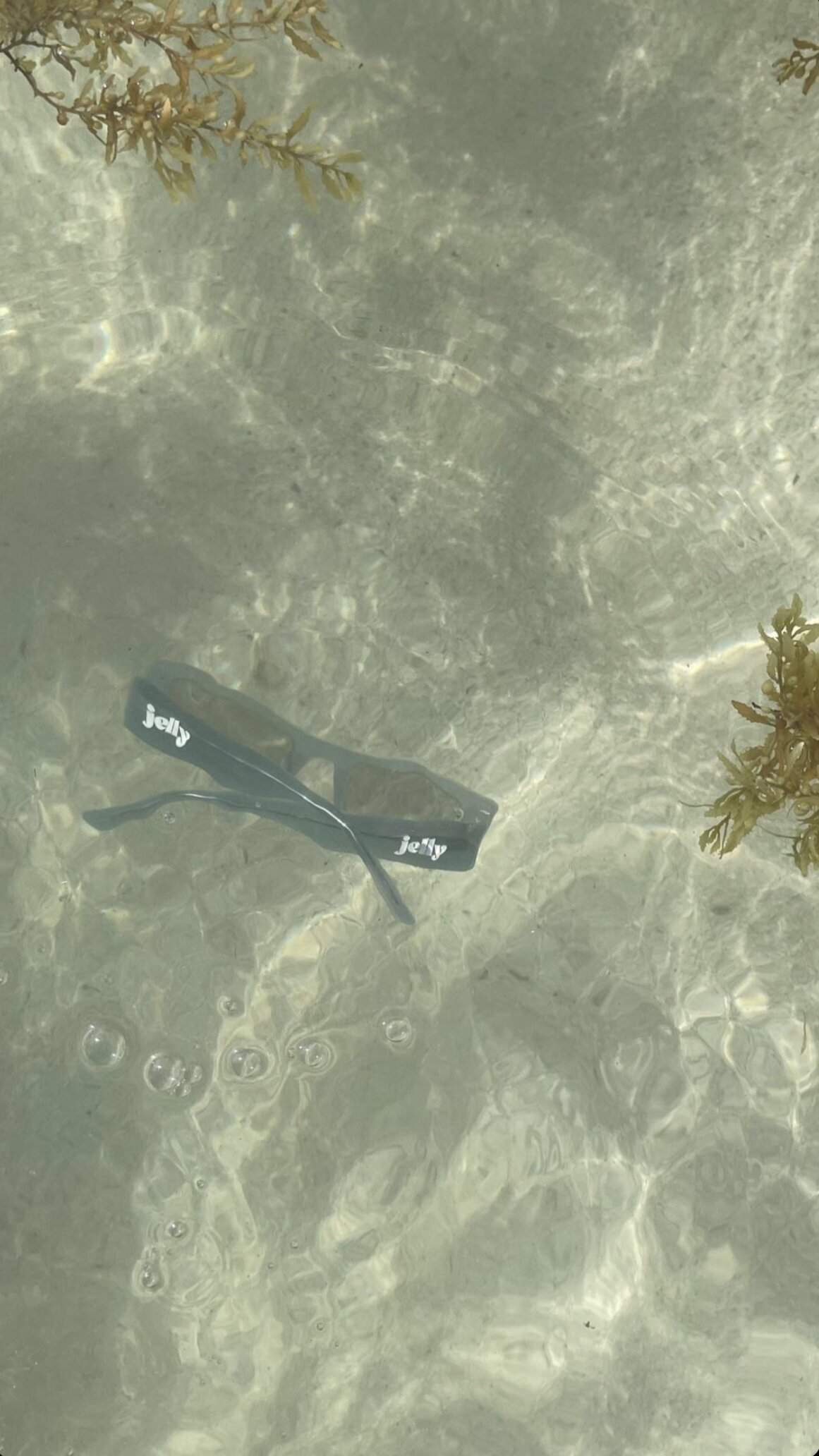 Branded sunglasses under water