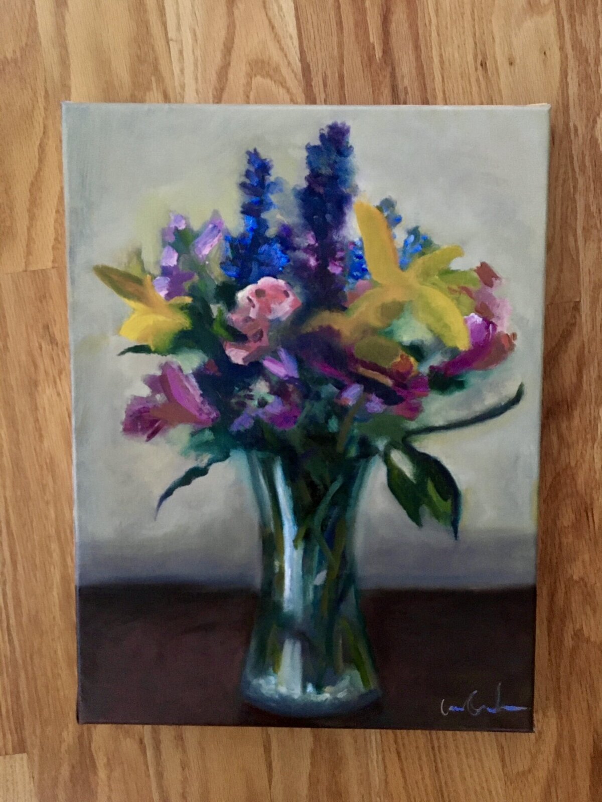 Still life oil painting of mulitcolored flowers in a vase