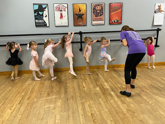 miss becky helping the little ones point their toes