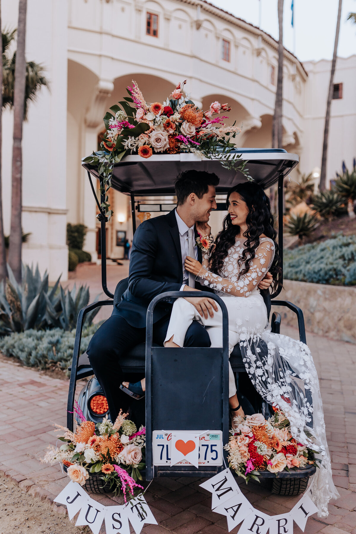 Destination elopement photographer captures couple in golf cart