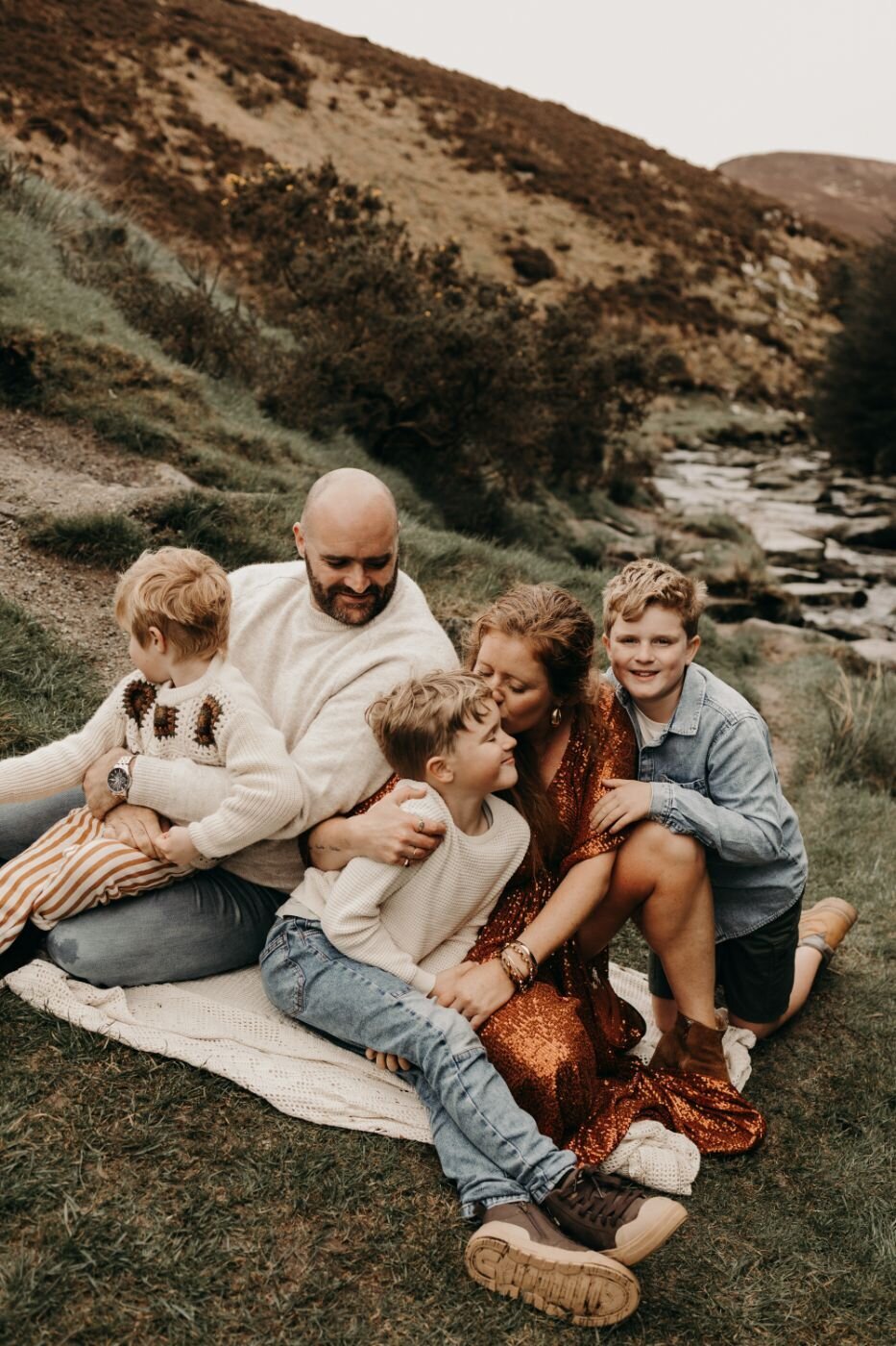 Mullingar family photography: parents with three sons in a scenic outdoor setting