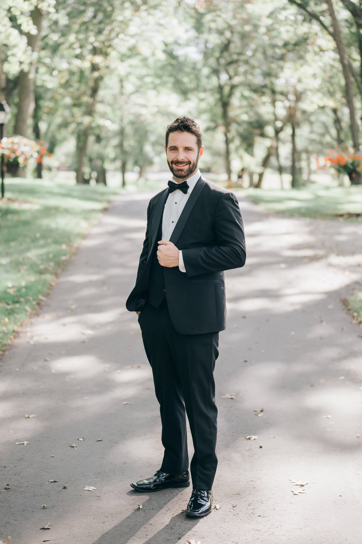 Groom looking chic in charcoal suit