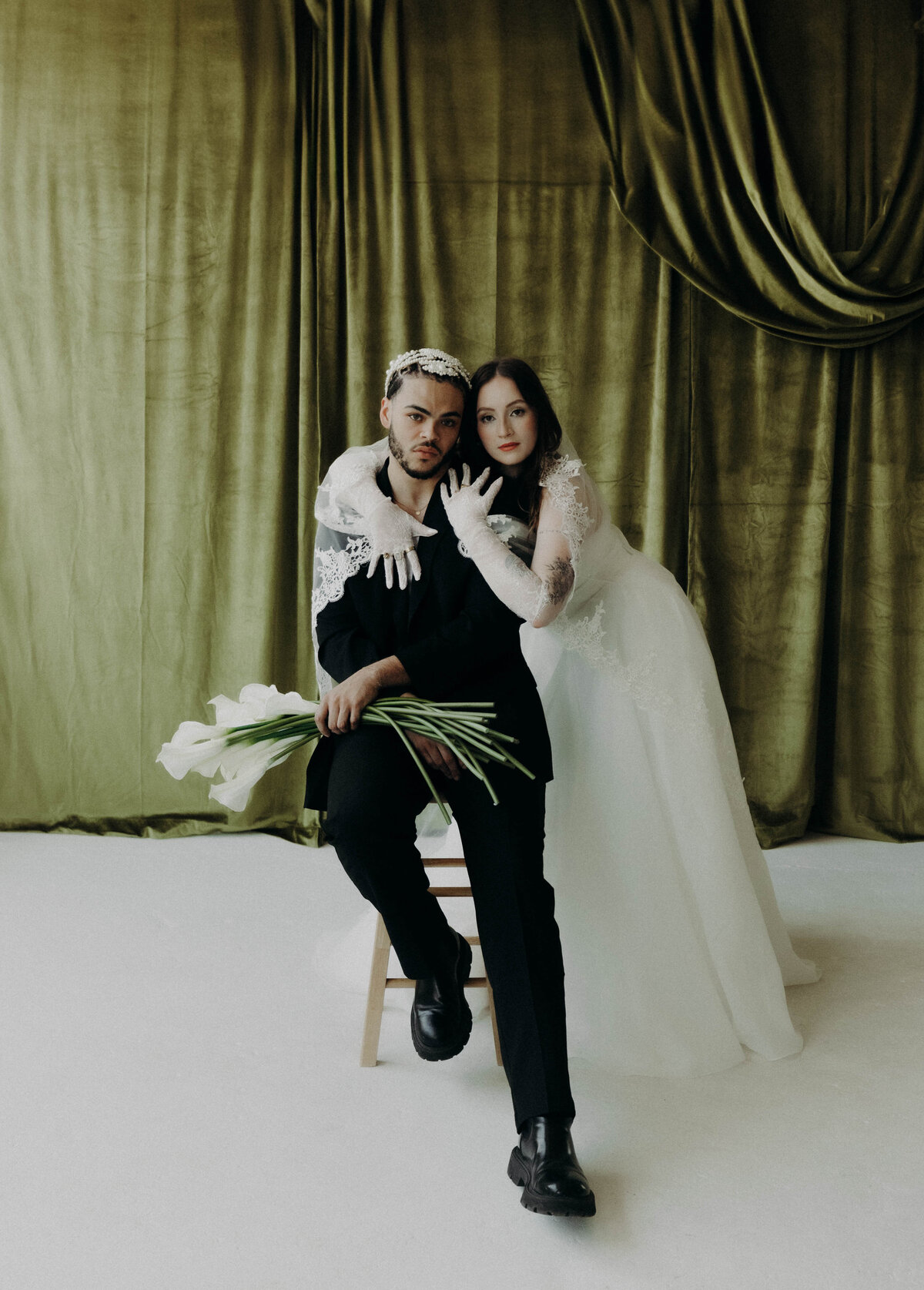 Bride and Groom portrait with green velvet backdrop