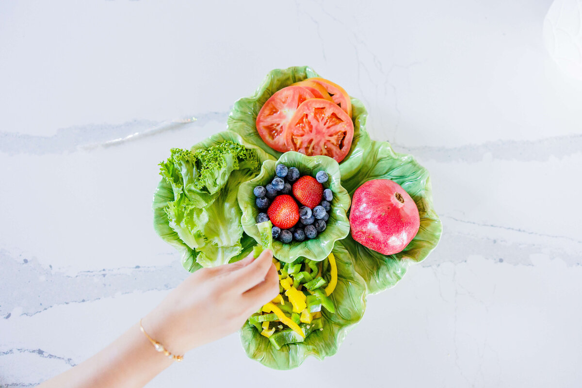 Hand grabbing some fruit