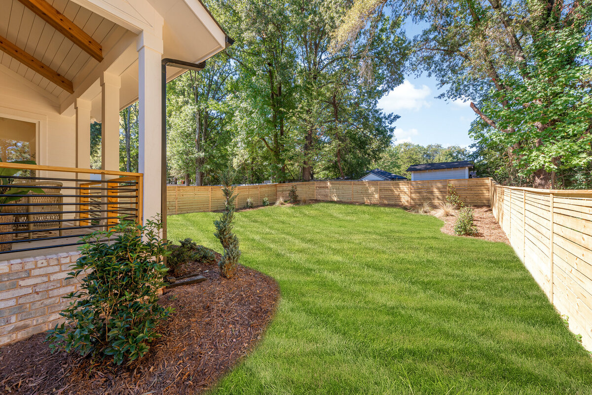 fenced backyard landscaping