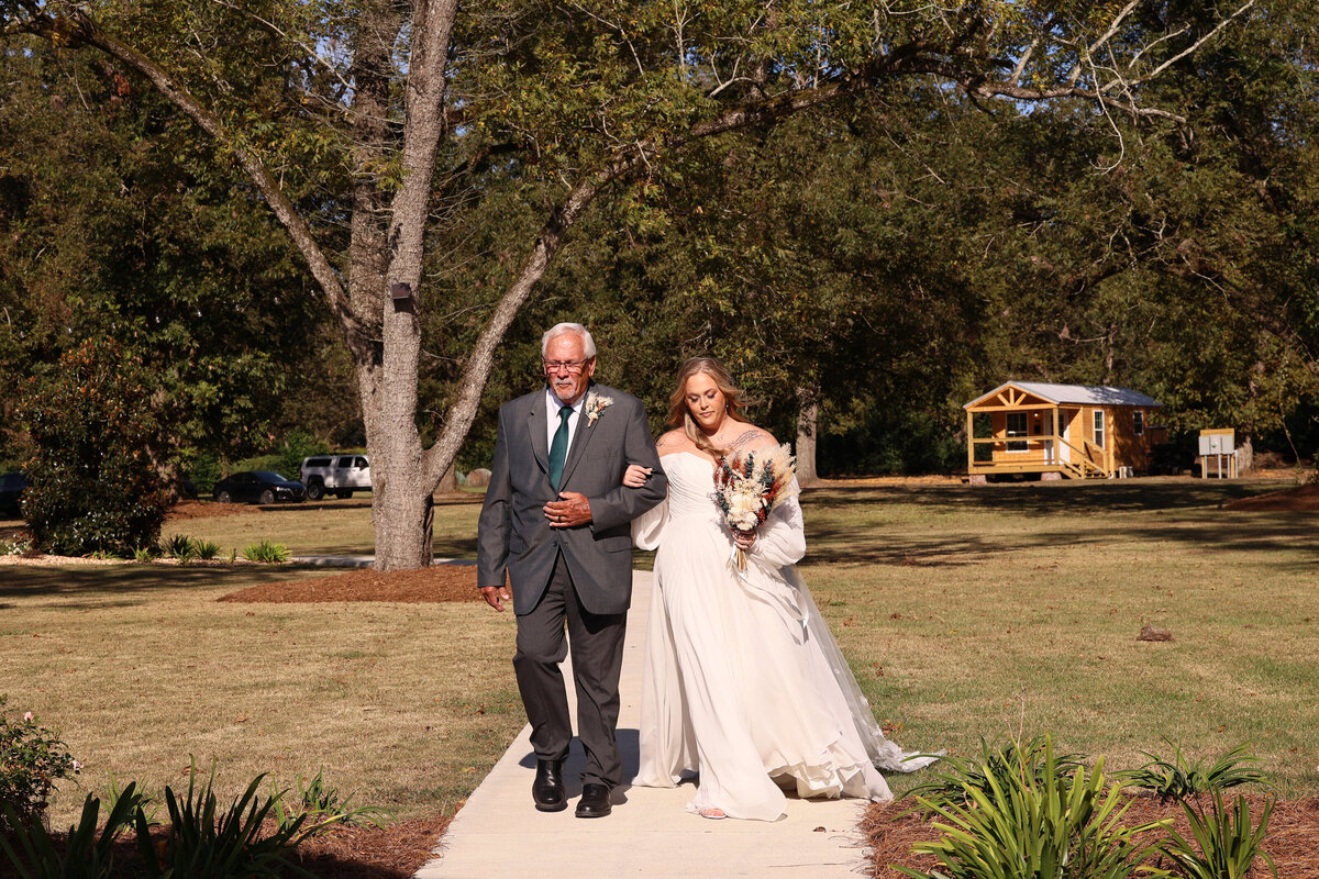 father and bride walking down the aisle at Cypress Pond Farms by Georgia wedding photographer Amanda Richardson Photography