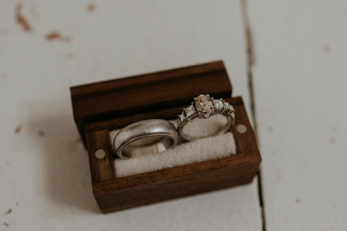 bride and grooms rings in a wooden box