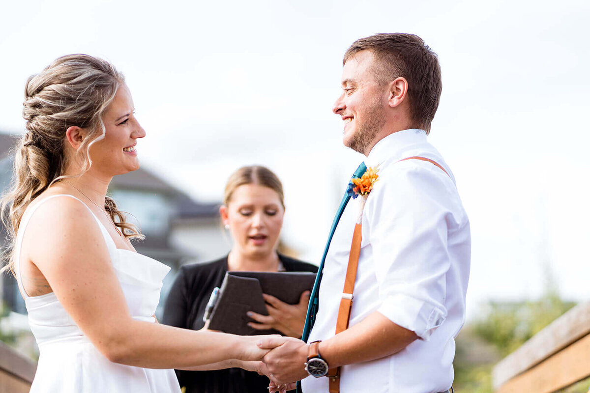 Bride and Groom share a smile during intimate ceremony