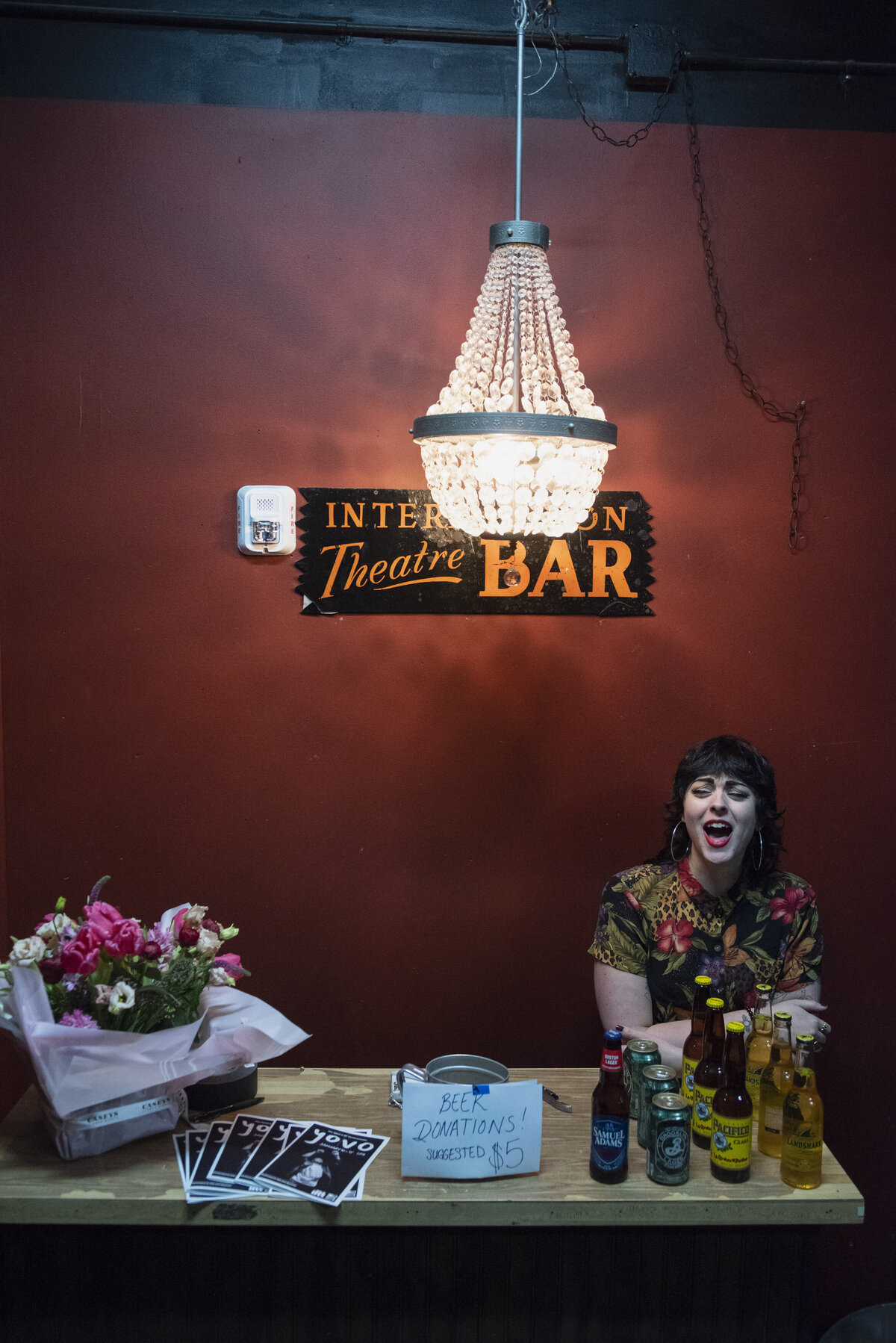 A person sitting at a table with props in front of them