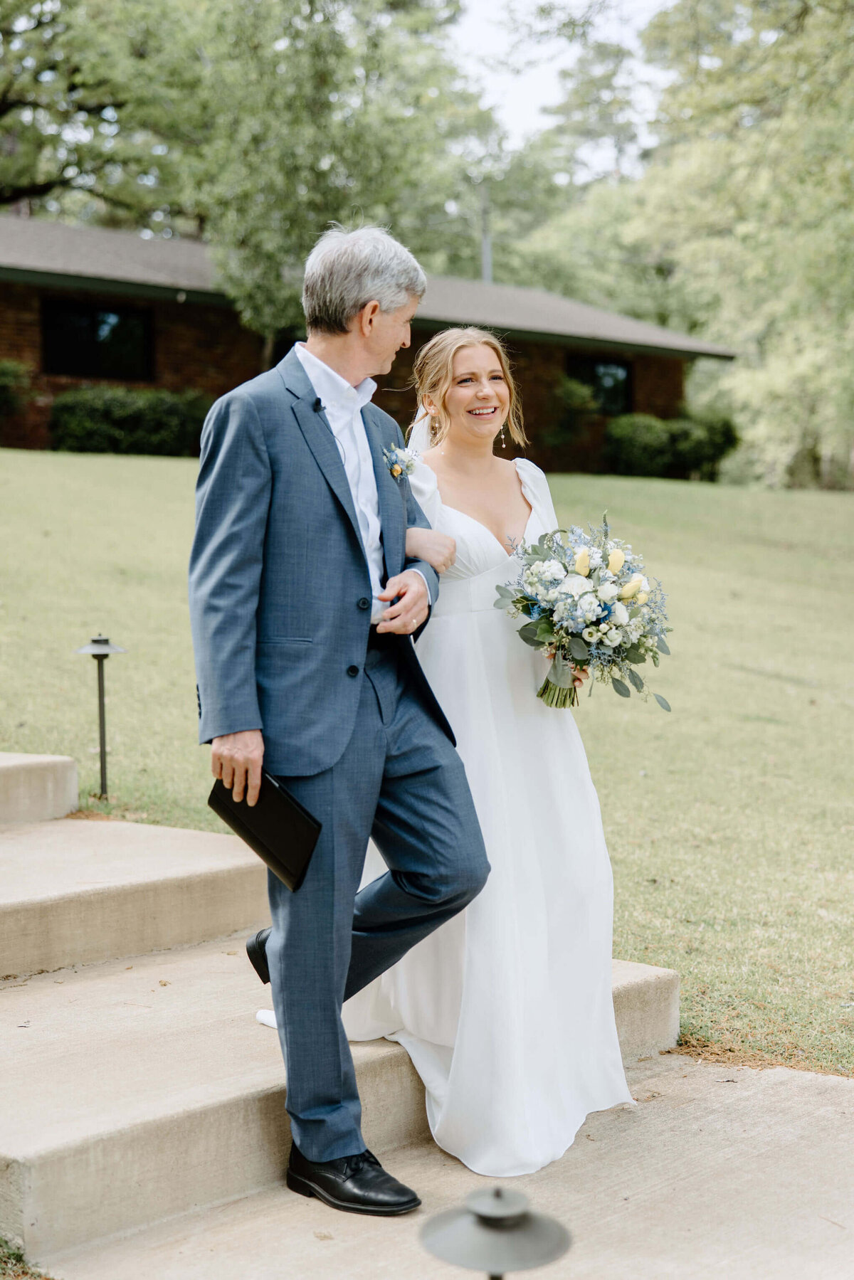 father walking bride down aisle  on wedding day