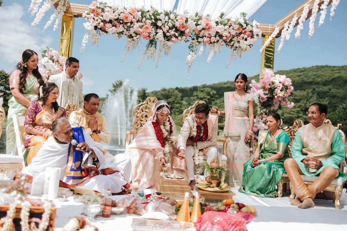 South Asian bride and groom embracing a moment of ceremony in Mahwah New Jersey.