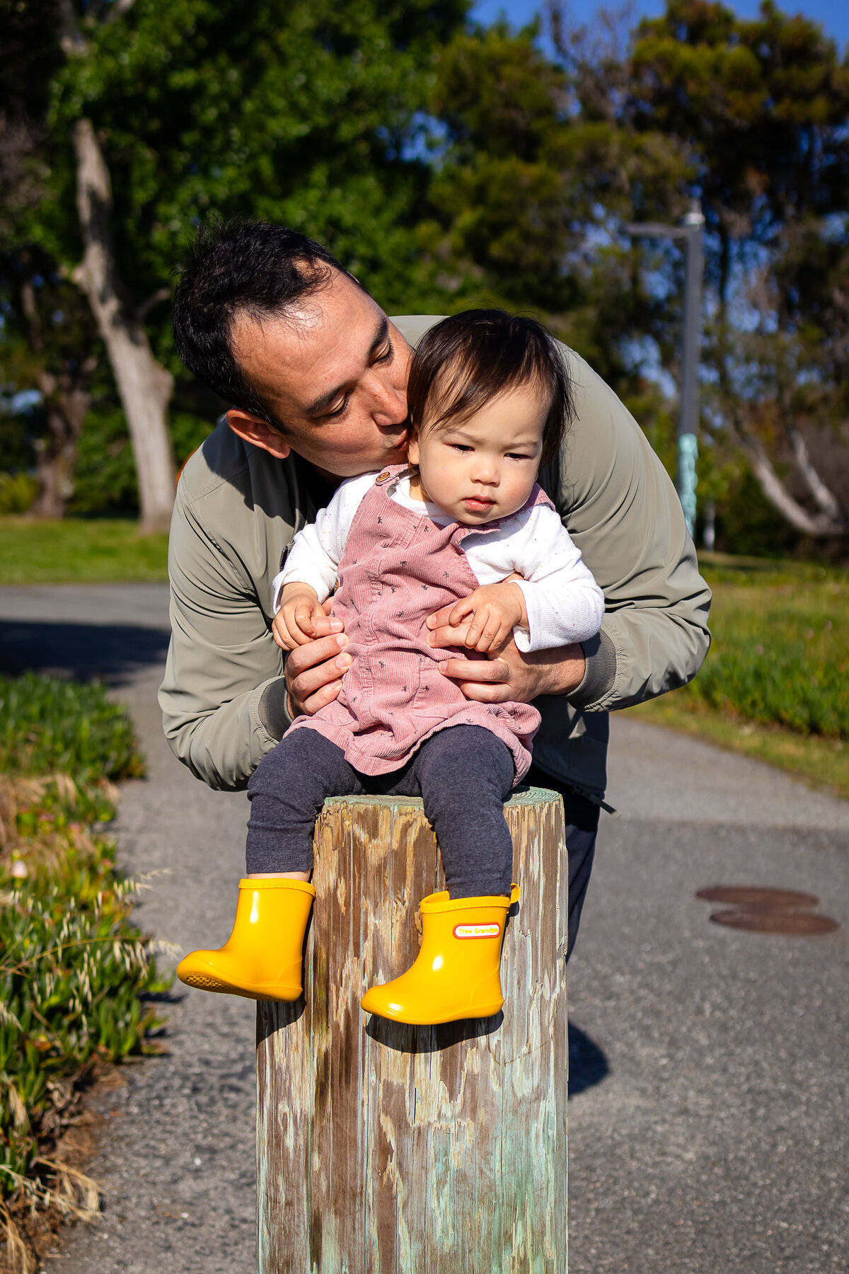 Candid moment of father and daughter toddler bonding by the San Francisco Bay – natural light family photography by Ellobelle Photography, San Francisco Peninsula Bay Trail Burlingame