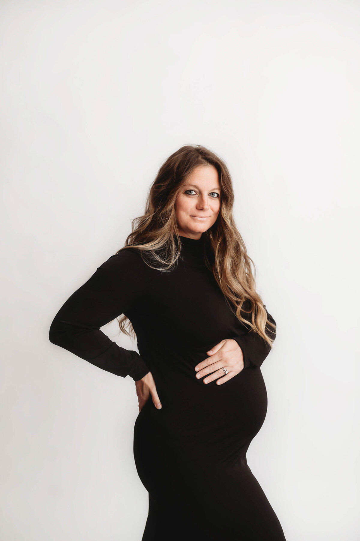 Expectant mother poses for Maternity Photos in Charleston, SC.