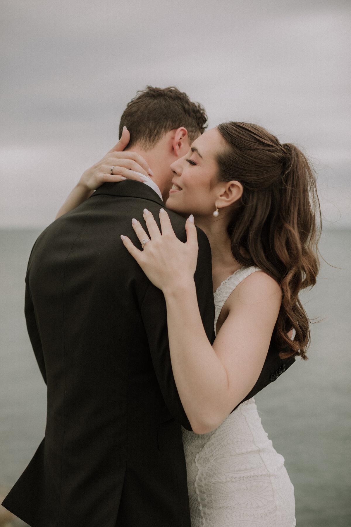 bride and groom hugging