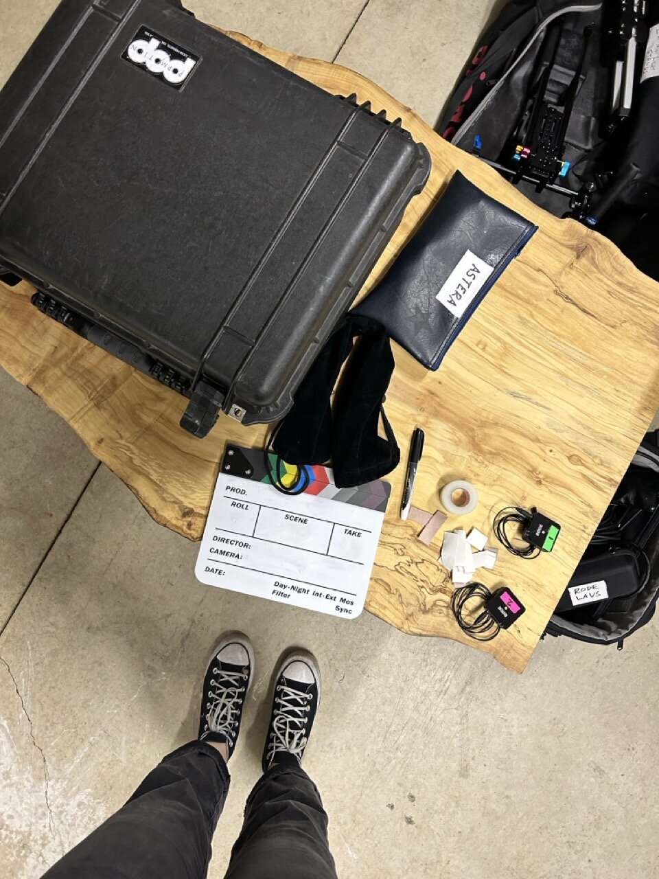 Various items sit on a table on a film set, representing short film production services offered by Good Girl Bad Girl Studios. 