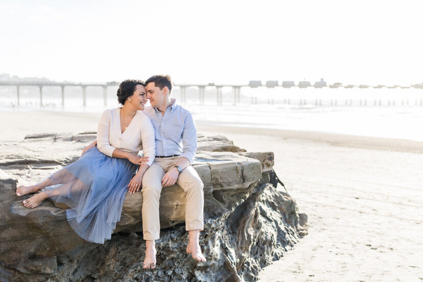 couple-sitting-on-rock-la-jolla-beach-san-diego