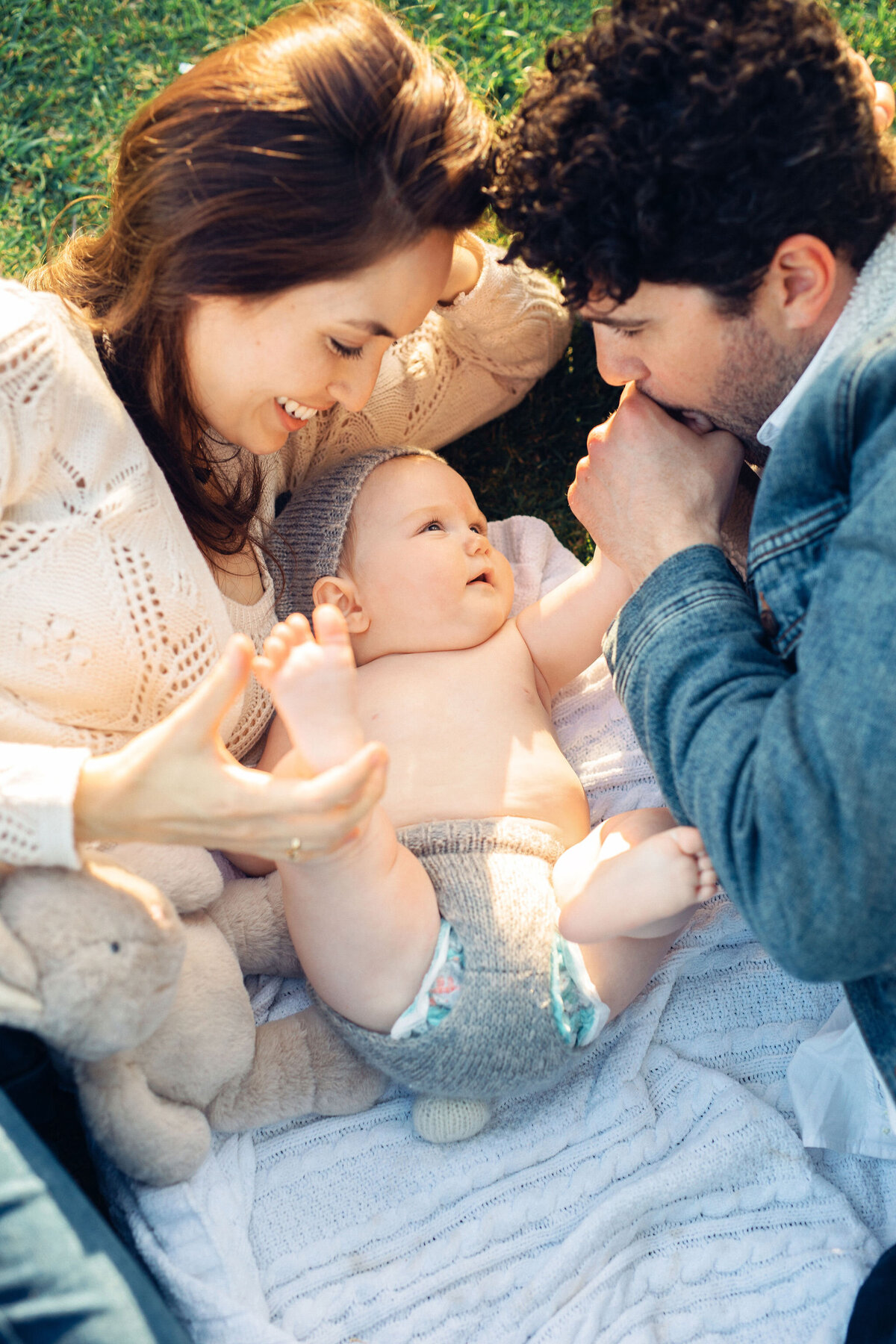 Family Portrait Photo Of Couple Looking At Their Baby In Los Angeles