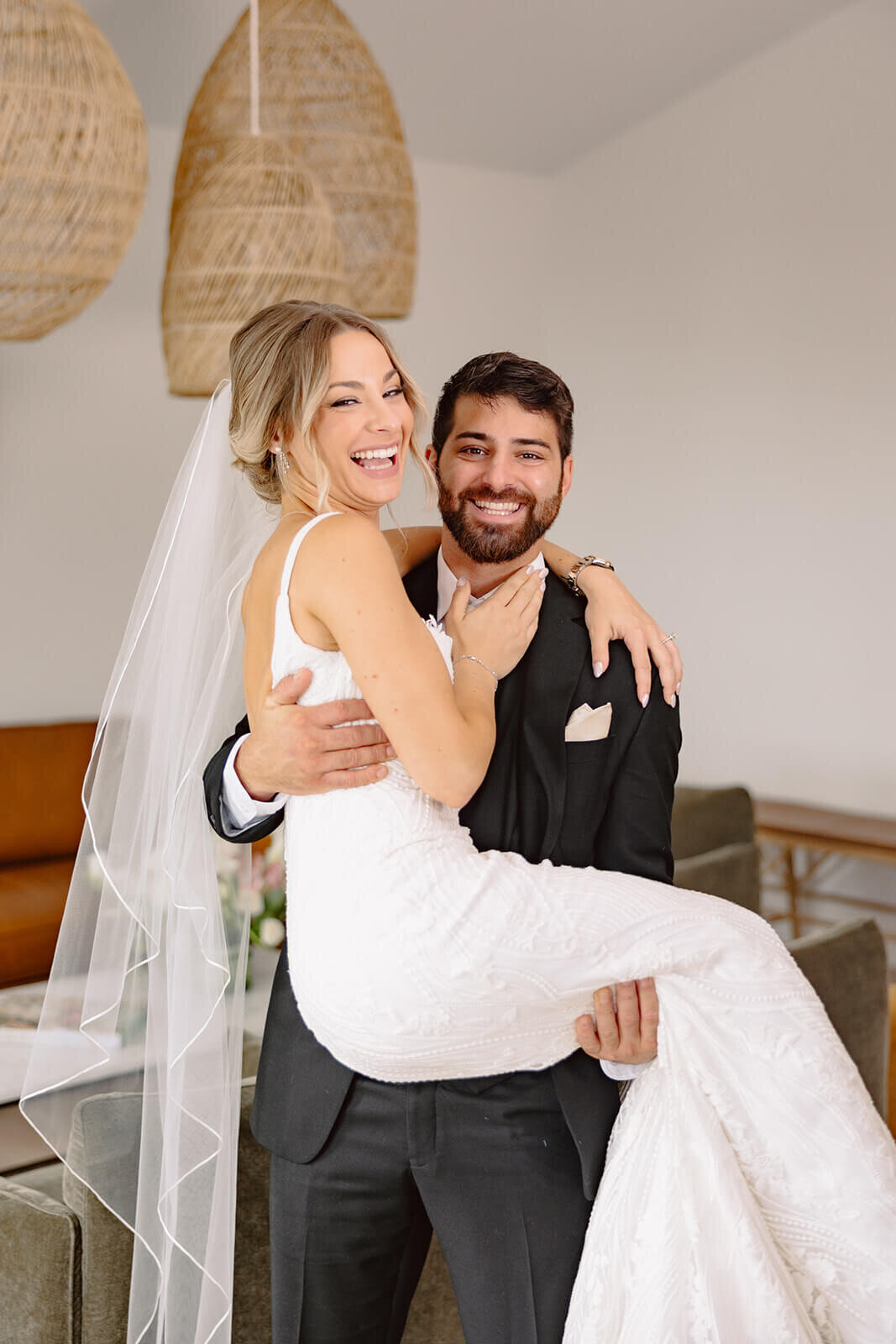 Groom lifting bride up