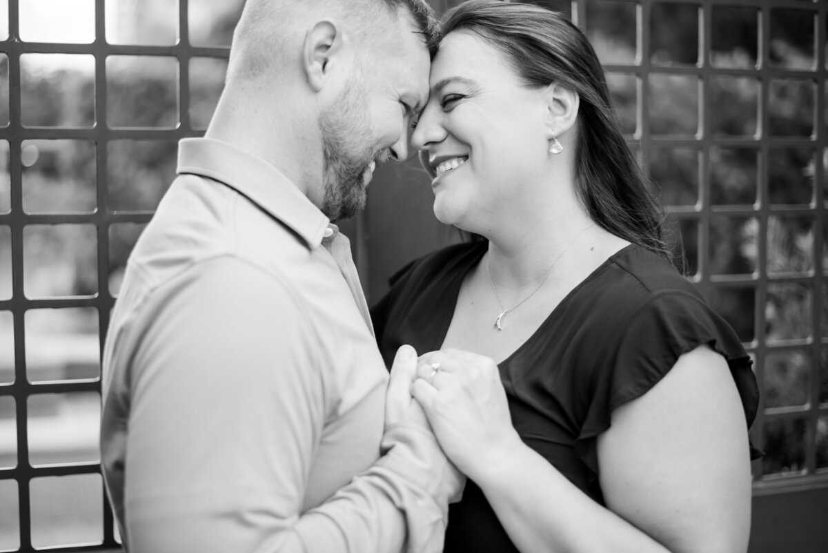 Capture the timeless bond of an engagement as this couple holds hands amidst the enchanting beauty of McGovern Centennial Gardens in Houston, Texas, beautifully portrayed in black and white