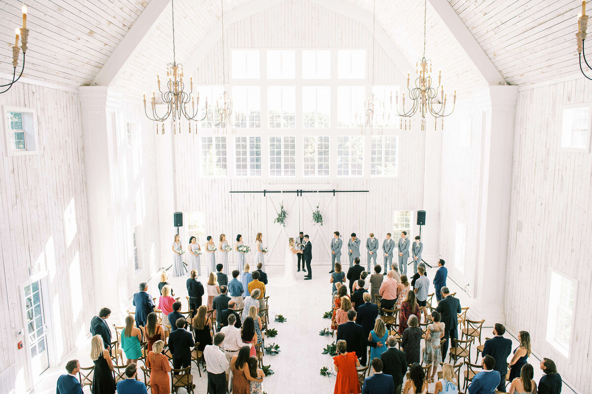 Elegant wedding ceremony in The White Sparrow barn in North Texas