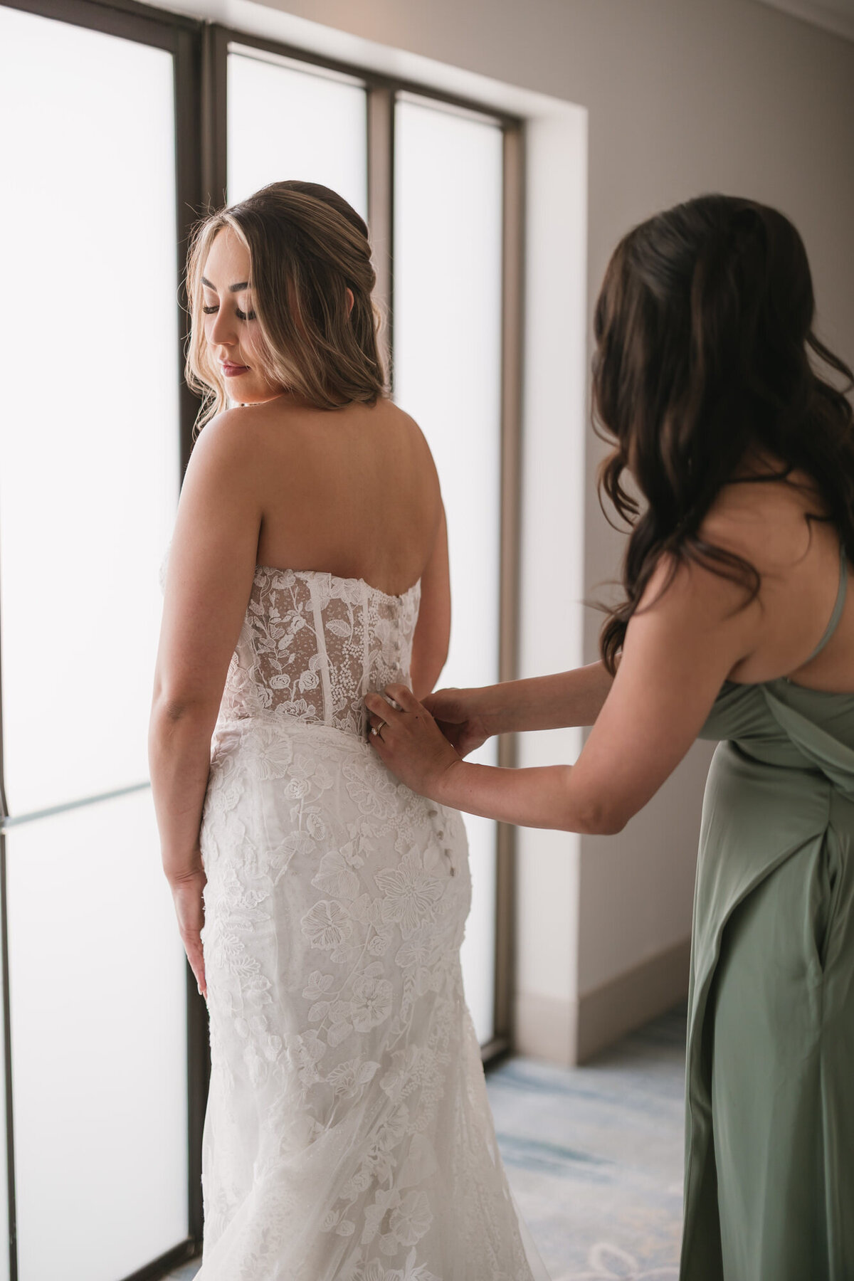 Bride getting ready for wedding day at Hilton Beachfront Resort Santa Barbara