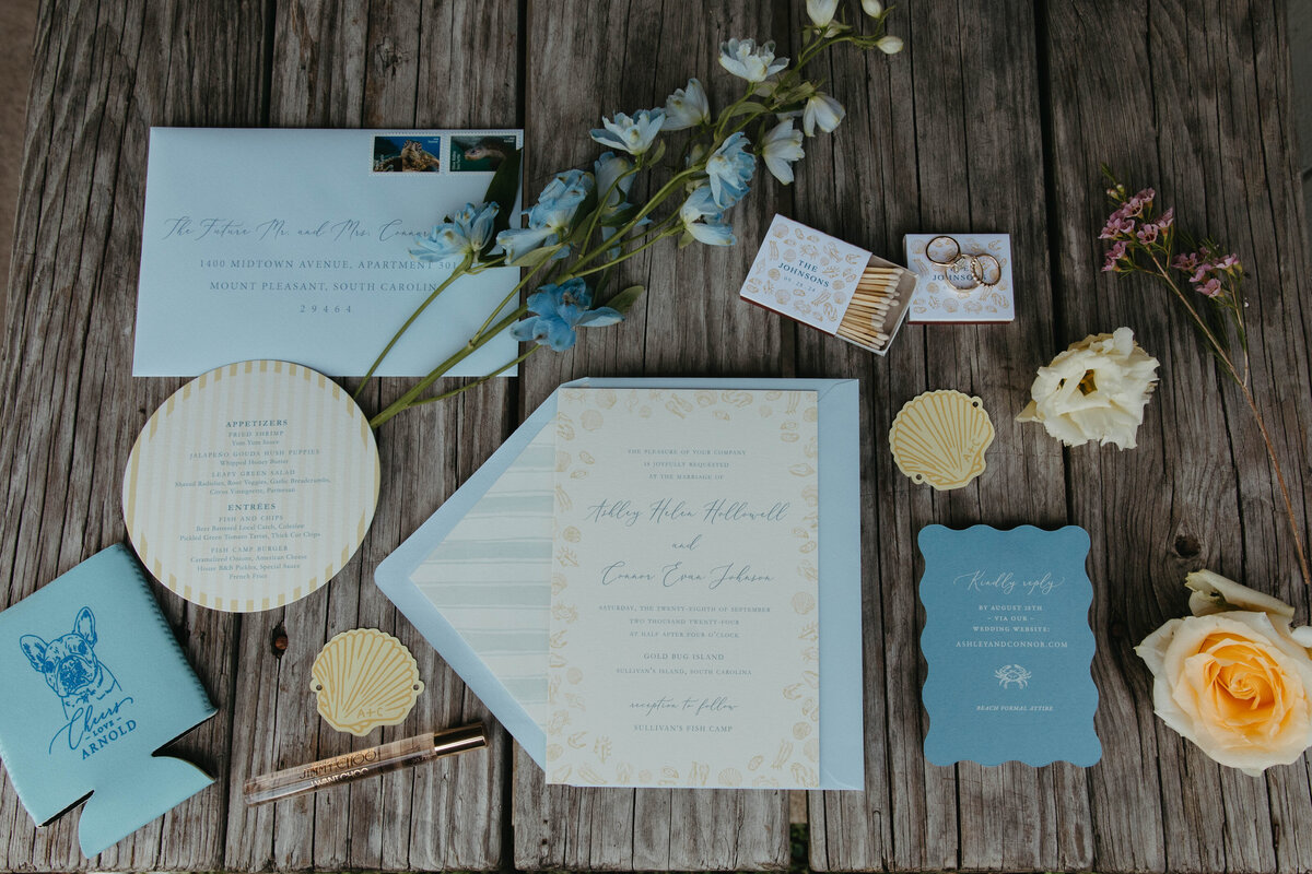 Invitation flatlay on picnic table