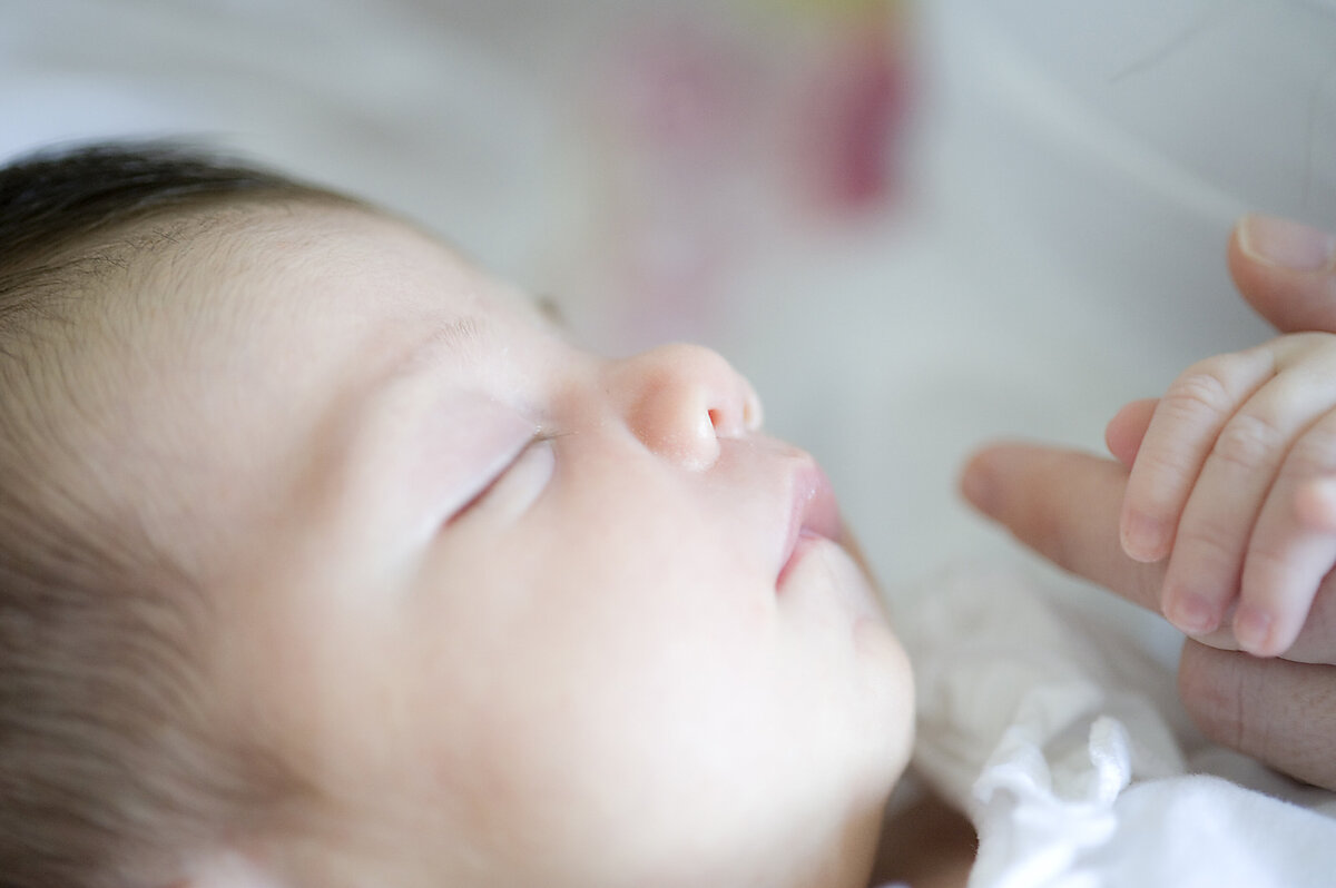 A newborn child sleeping 