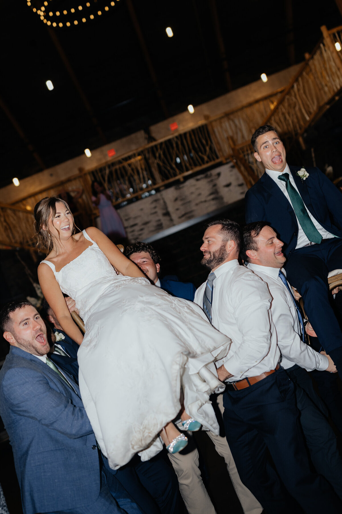 Candid moment of the couple laughing mid-dance during their wedding reception