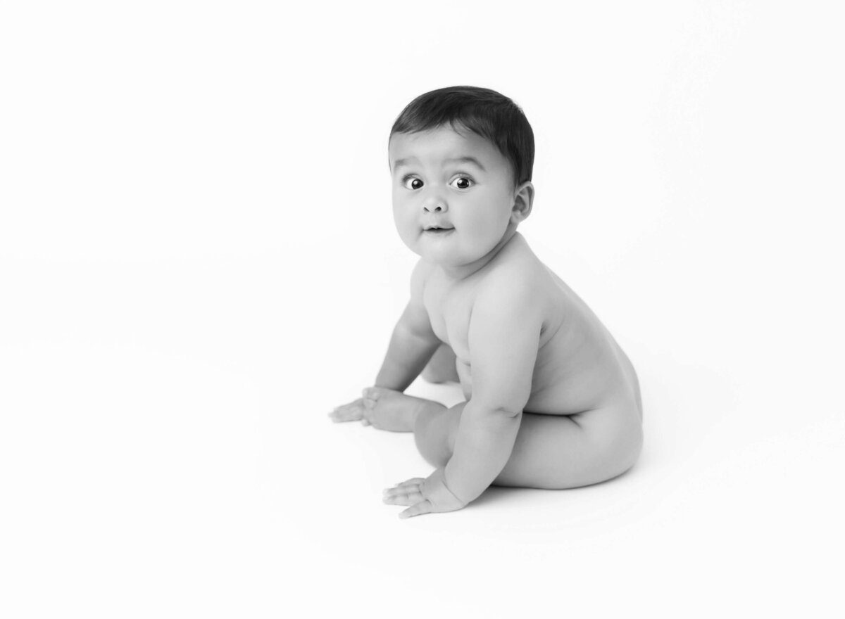 Baby boy posing during his baby photoshoot in Brooklyn B&W modern photography