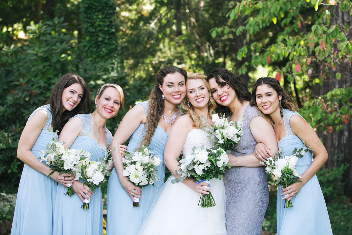 Bride with bridesmaids in blue dresses
