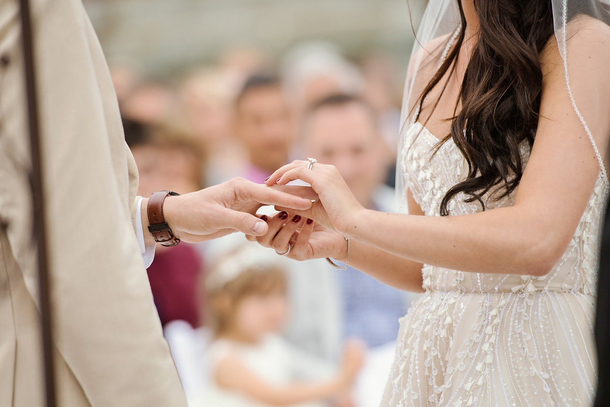 Exchange of rings at a wedding ceremony at The Bourne Mansion