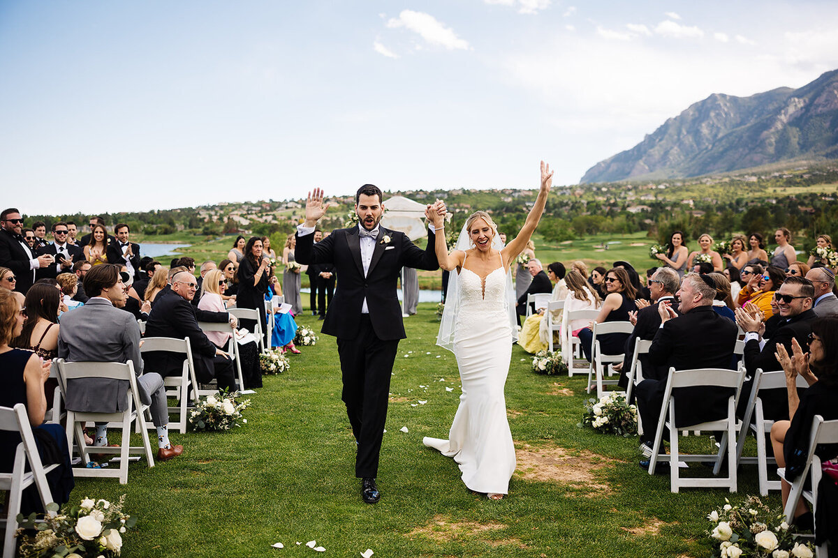 Bride and groom celebrate after saying I Do.