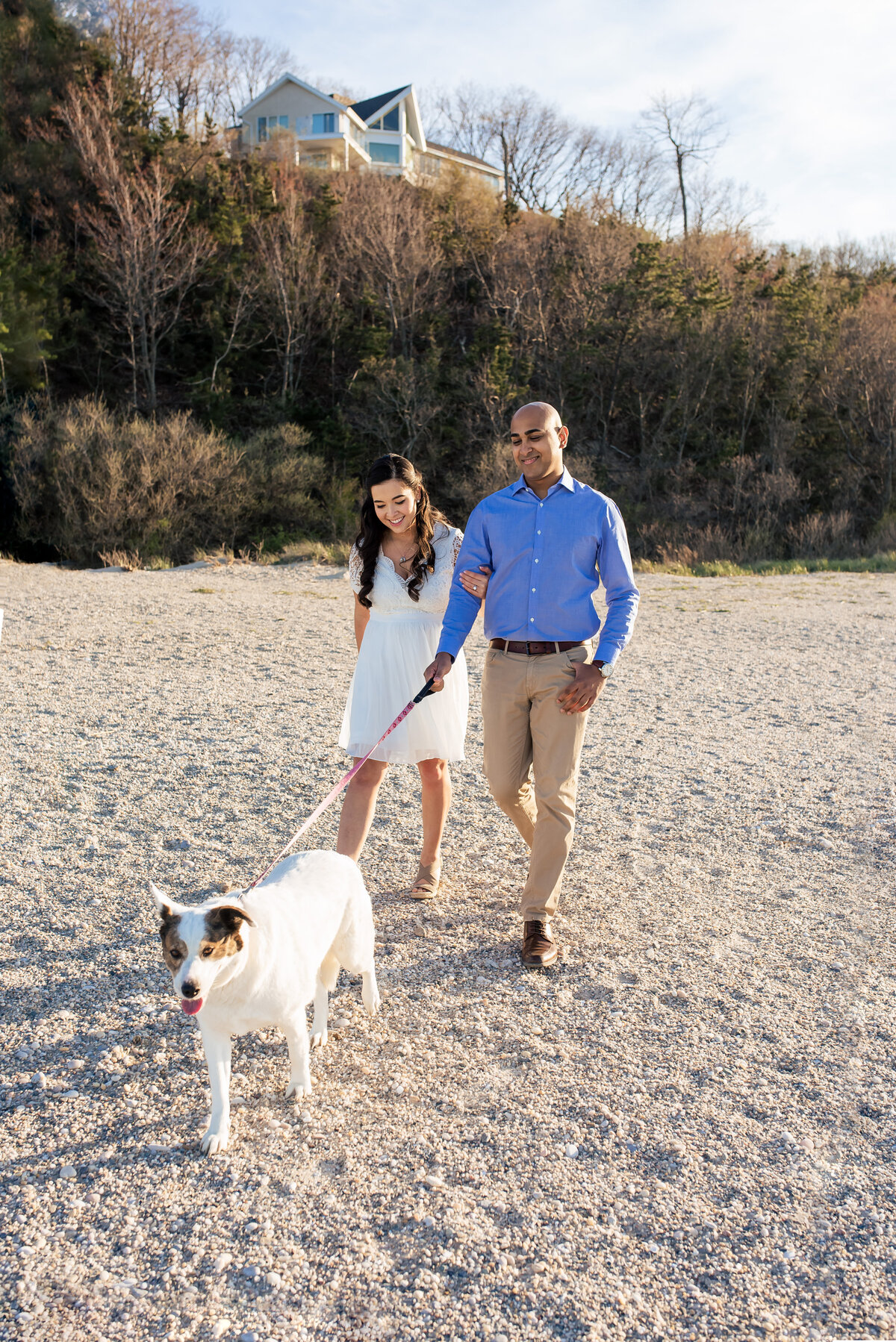 A sunny afternoon stroll with a couple and their dog on the beach in Port Jefferson