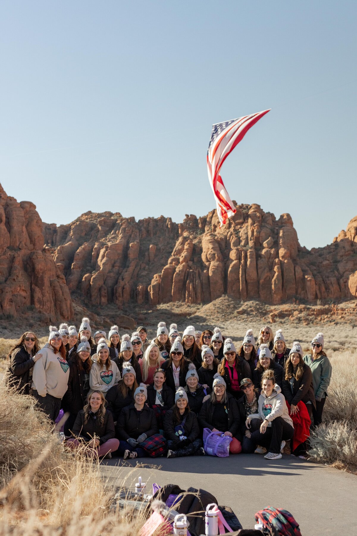 large group of women in zion with american flag