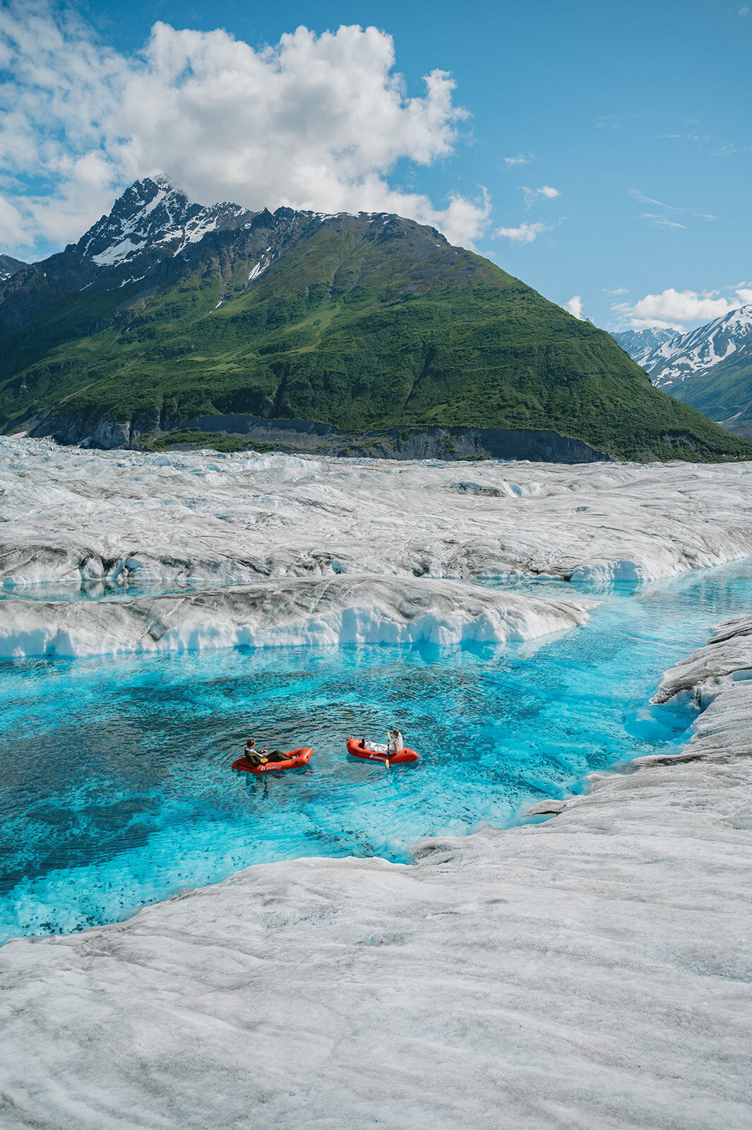 Couple paddle their kayak