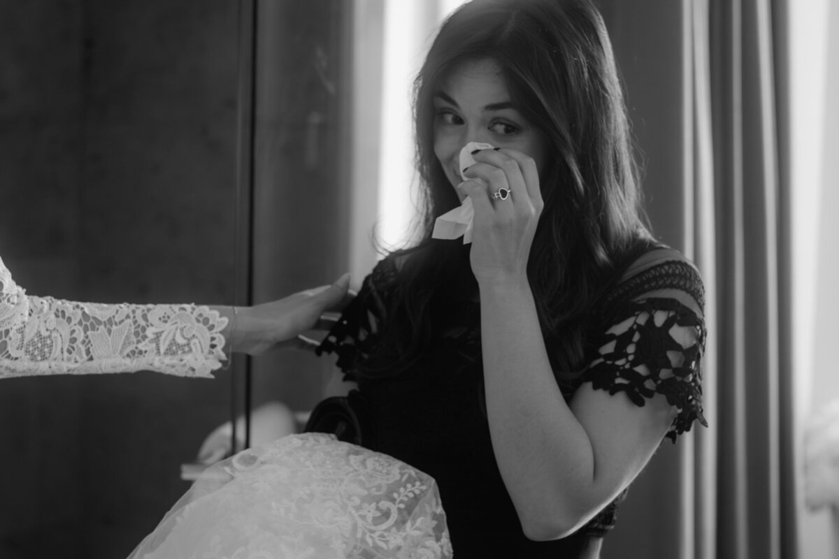 Pure emotions for the bridesmaid when the bride is ready for her wedding day - candid wedding photography.