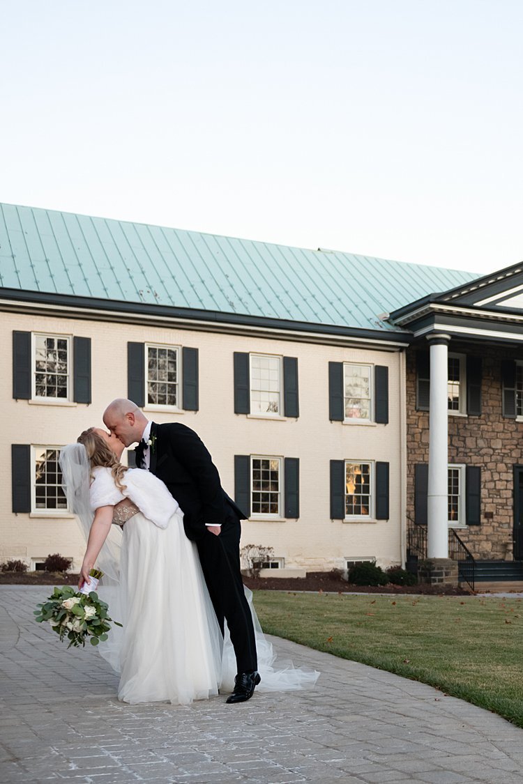 Groom dipping Bride in front of mansion on Washington and Jefferson University Campus in Beaver, PA