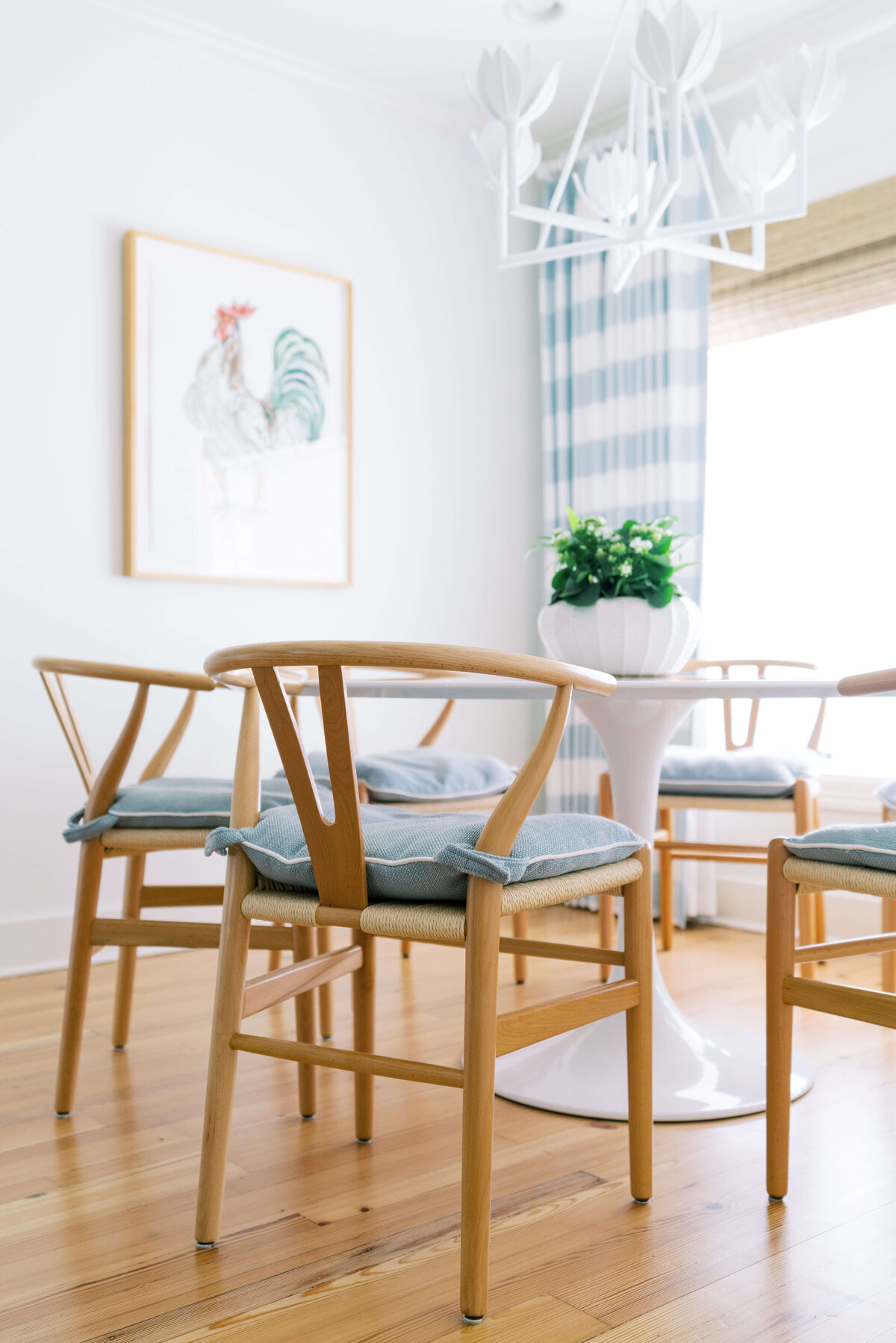 oyster creek studios happy valley wooden chairs with blue pillows around a white table