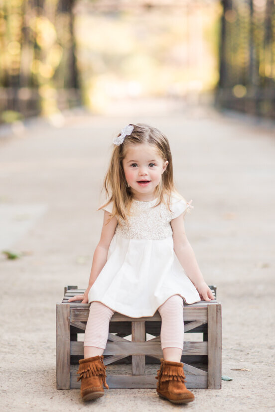 young-girl-sitting-on-crate--sweetwater-river-bridge-san-diego