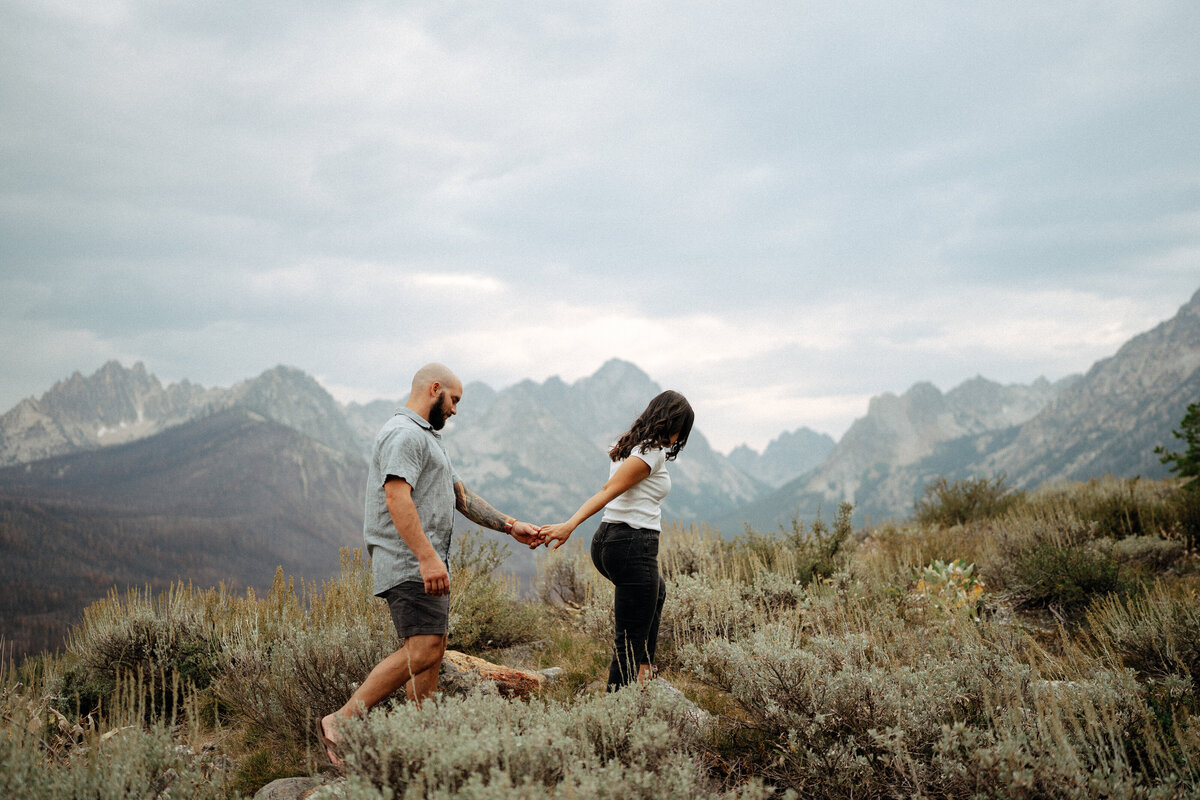 Couple during golden hour engagement shoot in Stanley, Idaho wedding/elopement - photographed by The Storytellers