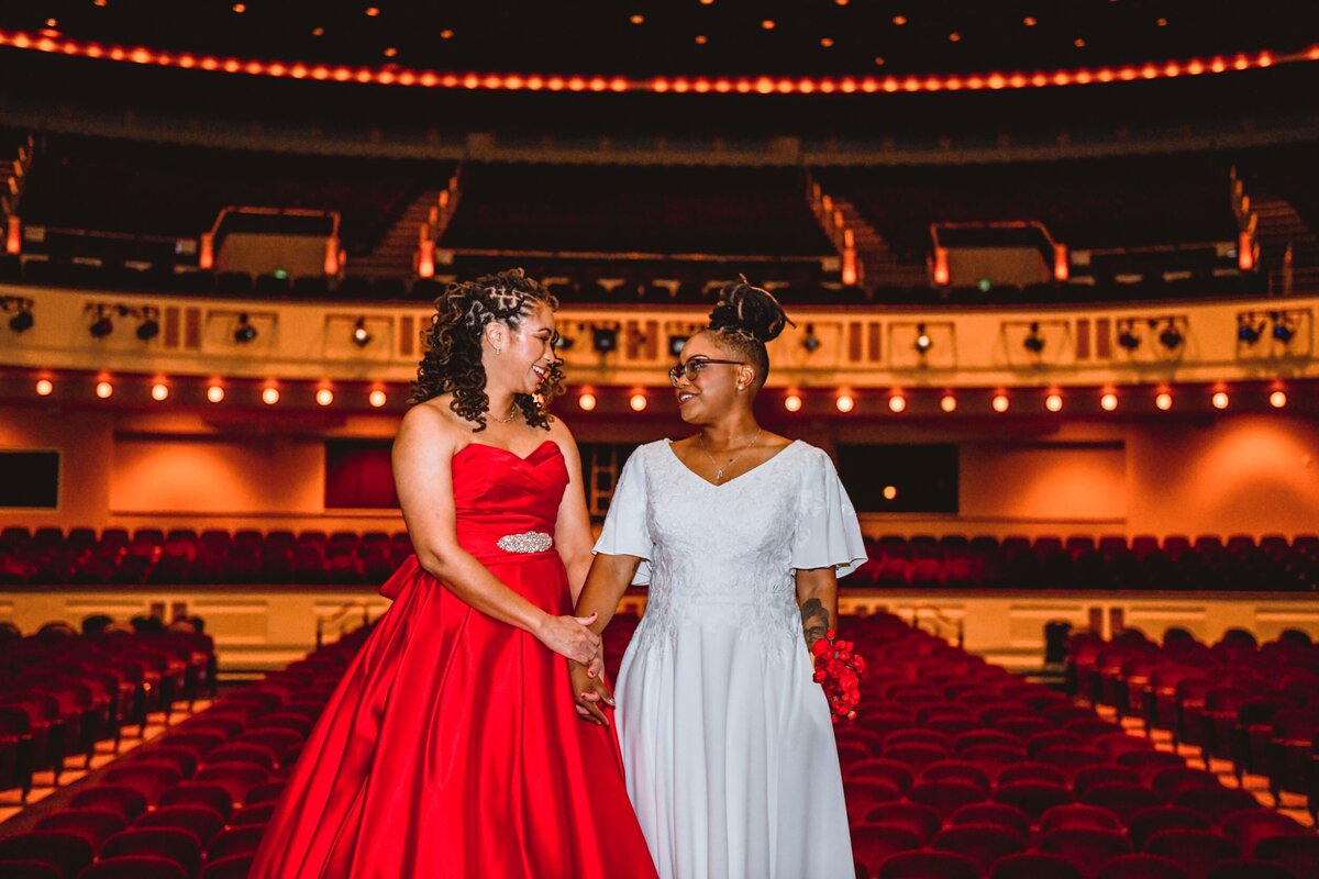 22 - Mahaffey Theater LGBTQ+  Couple on Stage - Tampa Bay Wedding Planner