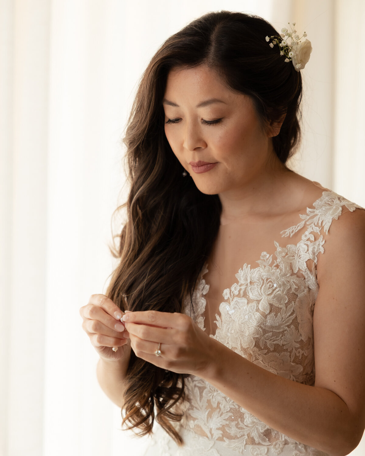 candid bride getting ready Wedding Photos in Pismo Beach at Dolphin Bay Resort & Spa
