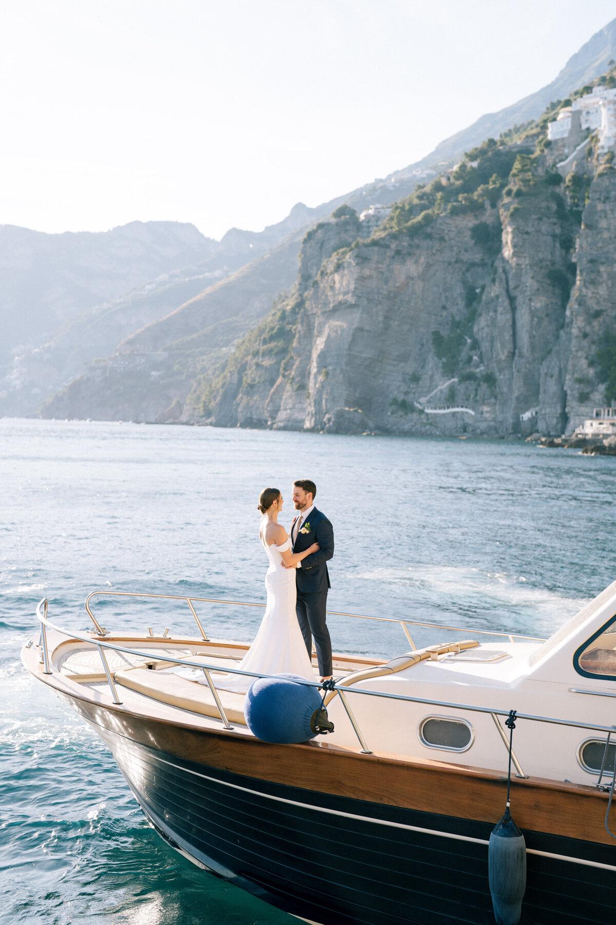 Bride and groom on a boat at Positano wedding
