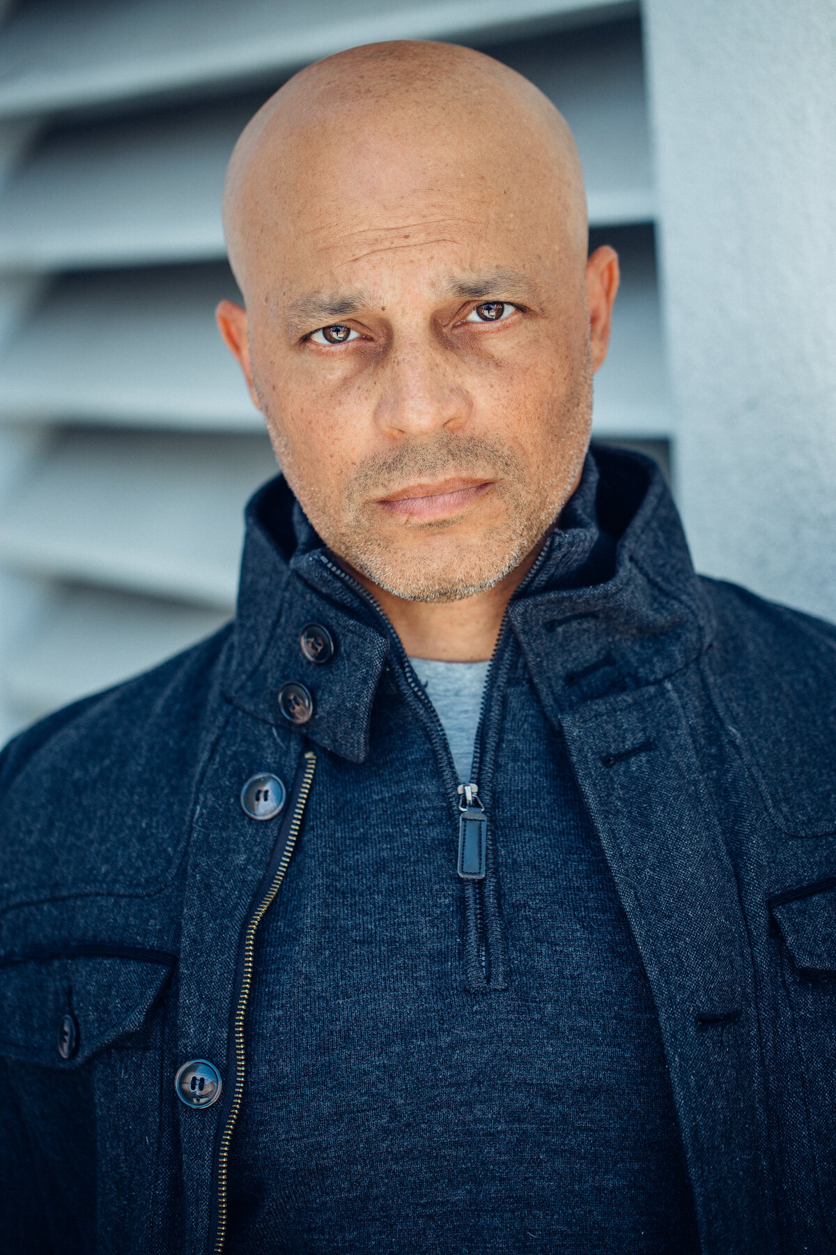 Headshot Photograph Of Man In Outer Dark Blue Jacket And Inner Dark Blue jacket Los Angeles