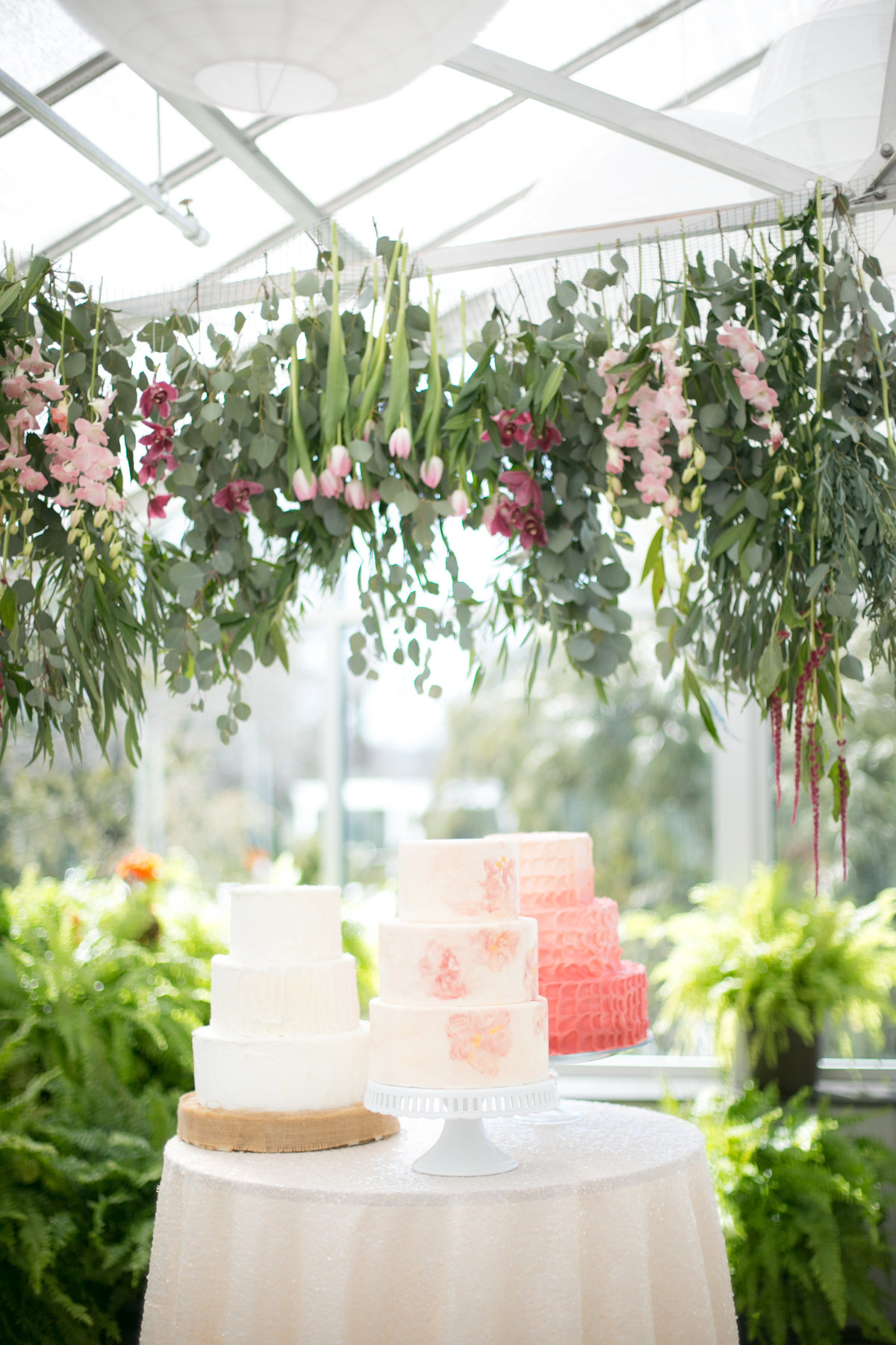 3 white and pink wedding cakes