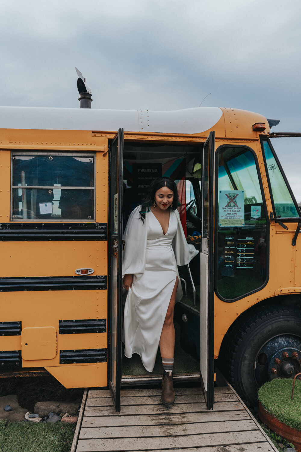 Bride walks out of a school bus 