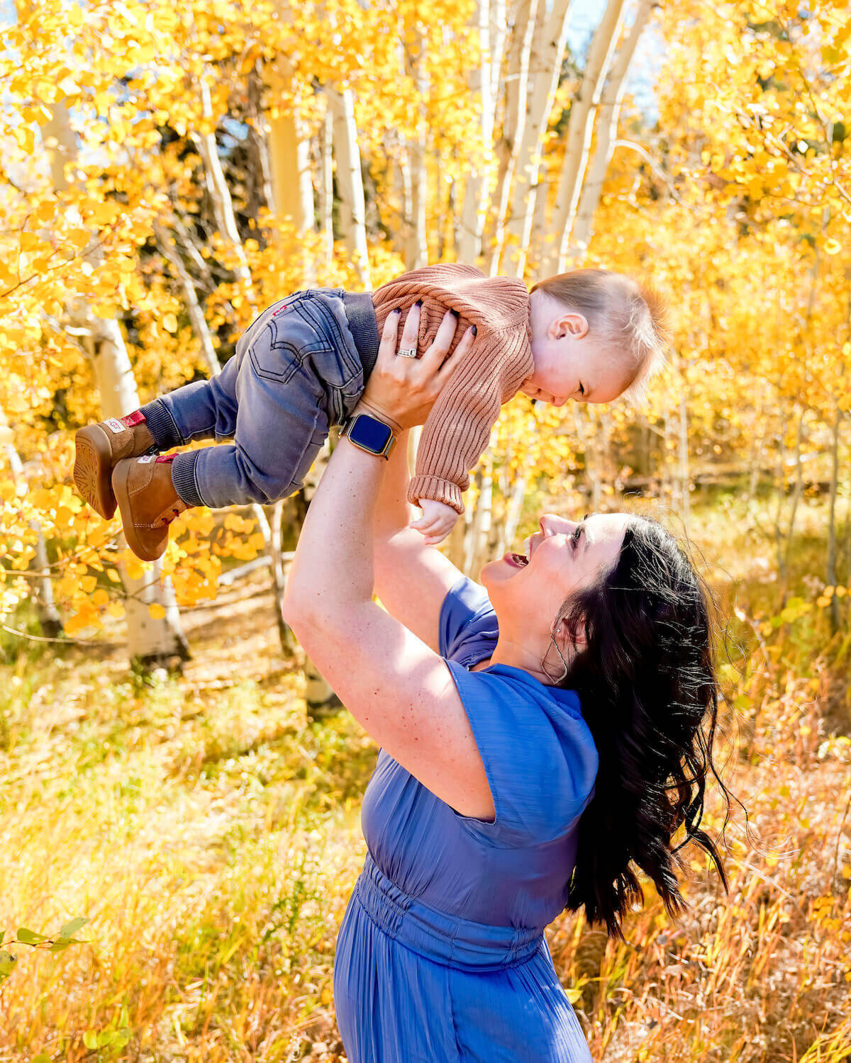 family photography denver co - woman in blue holding toddler up