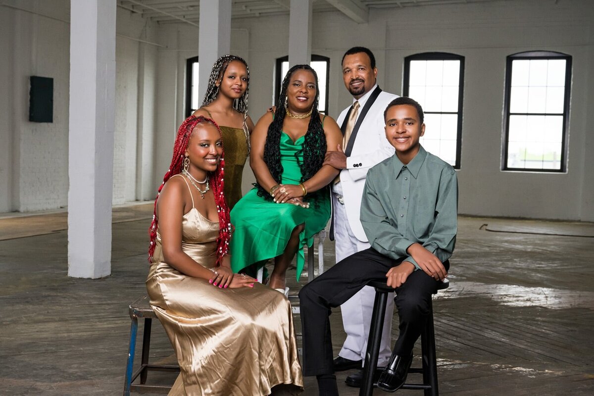 Family Portrait in Industrial Setting With Elegant Attire and Bright Smiles-34