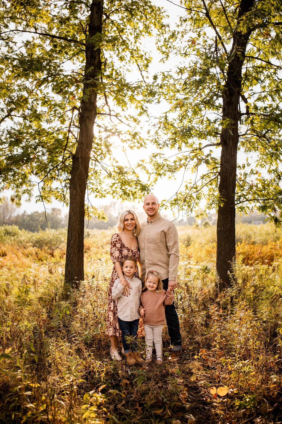 Family Posing in the fall at Hoosier Prairie in Griffith Indiana